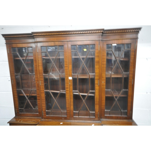 198 - A LATE 20TH CENTURY MAHOGANY BREAKFRONT BOOKCASE, fitted with four glazed doors, atop a base with th... 