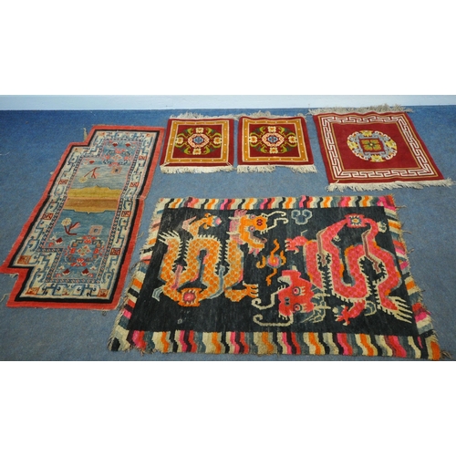 199 - A TIBETAN RECTANGULAR RUG, depicting two dragons, black field, and a multi-coloured border, 139cm x ... 