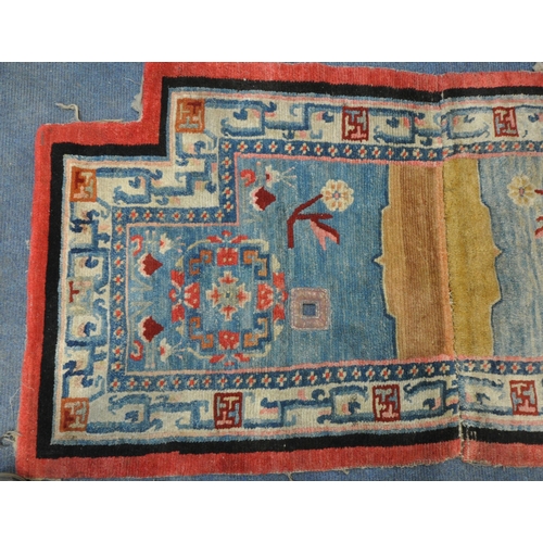 199 - A TIBETAN RECTANGULAR RUG, depicting two dragons, black field, and a multi-coloured border, 139cm x ... 