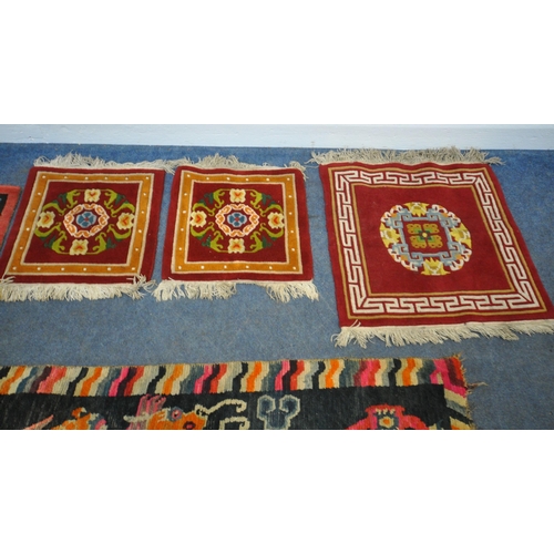 199 - A TIBETAN RECTANGULAR RUG, depicting two dragons, black field, and a multi-coloured border, 139cm x ... 