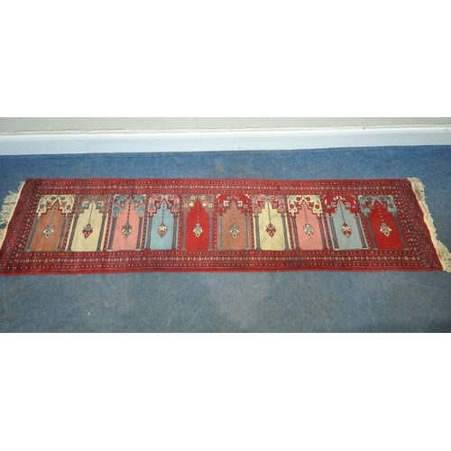 200 - A 20TH CENTURY TURKISH MIDJUR CARPET RUNNER, with ten repeating patterns, surrounded by a multi-stra... 