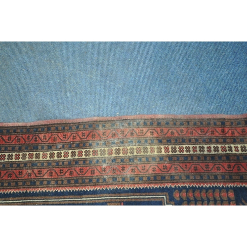 202 - TWO IRANIAN RED RUGS, both with repeating patterns, and a multi-strap border, largest 180cm x 106cm,... 