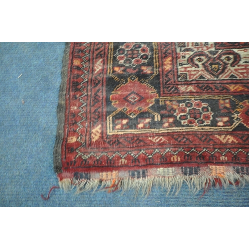 202 - TWO IRANIAN RED RUGS, both with repeating patterns, and a multi-strap border, largest 180cm x 106cm,... 