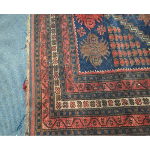 202 - TWO IRANIAN RED RUGS, both with repeating patterns, and a multi-strap border, largest 180cm x 106cm,... 