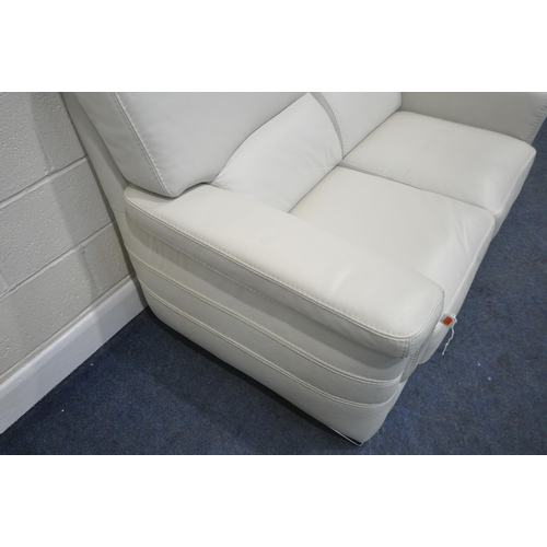 210 - A CREAM LEATHER TWO SEATER SOFA, length 143cm x depth 93cm x height 104cm, condition report: could u... 