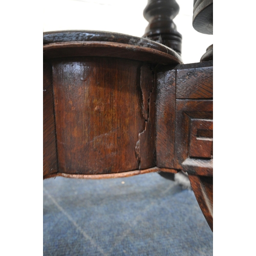 213 - AN EDWARDIAN OAK FOLD OVER CARD / GAMES TABLE, the swivel top opens to reveal a green baize playing ... 