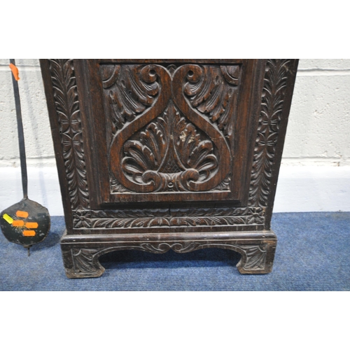 216 - A GEORGIAN OAK CASED EIGHT DAY LONGCASE CLOCK, with intricate carvings all over, the square glass do... 