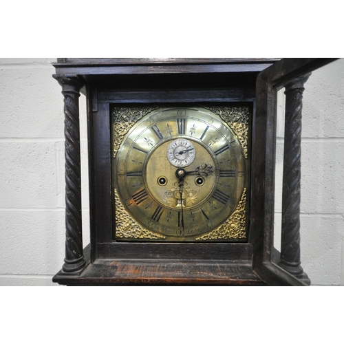 216 - A GEORGIAN OAK CASED EIGHT DAY LONGCASE CLOCK, with intricate carvings all over, the square glass do... 