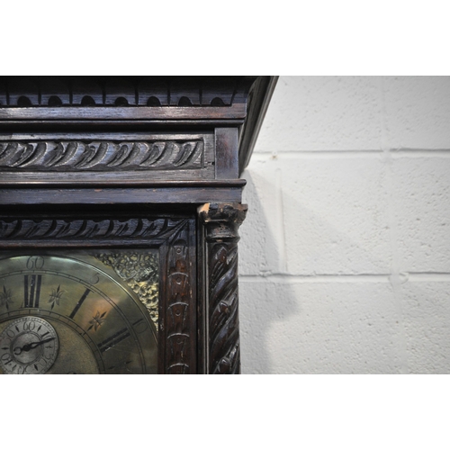 216 - A GEORGIAN OAK CASED EIGHT DAY LONGCASE CLOCK, with intricate carvings all over, the square glass do... 