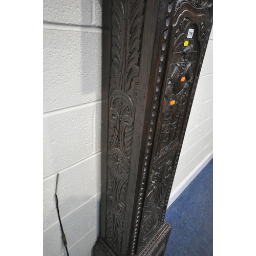 216 - A GEORGIAN OAK CASED EIGHT DAY LONGCASE CLOCK, with intricate carvings all over, the square glass do... 