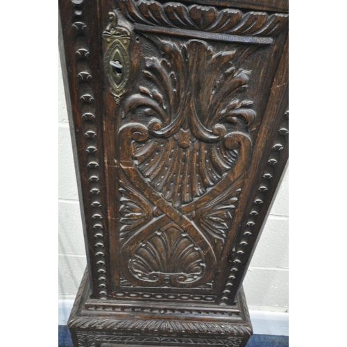 216 - A GEORGIAN OAK CASED EIGHT DAY LONGCASE CLOCK, with intricate carvings all over, the square glass do... 