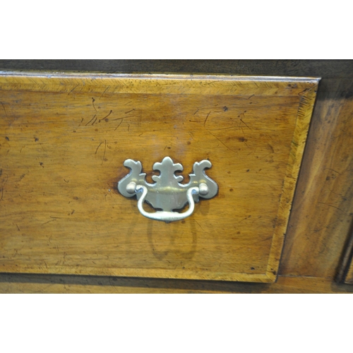 218 - A REPRODUCTION GEORGIAN STYLE DRESSER BASE, fitted with three frieze drawers, raised on front cabrio... 