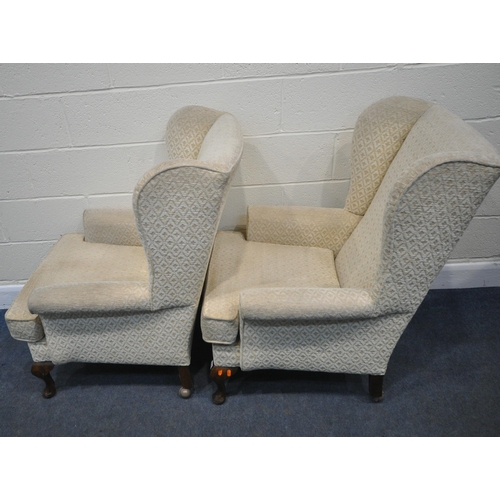 228 - A PAIR OF OATMEAL UPHOLSTERED WING BACK ARMCHAIRS, raised on front cabriole legs, width 71cm x depth... 