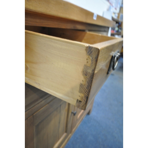 238 - A MODERN SOLID OAK SIDEBOARD, fitted with four drawers, over double cupboard doors, width 100cm x de... 