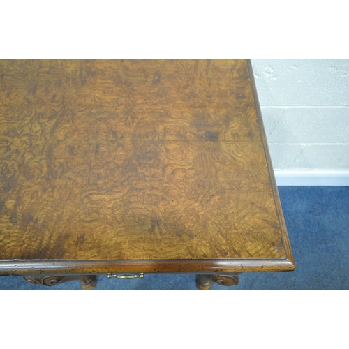 244 - A QUEEN ANNE STYLE BURR ELM DRESSER BASE, fitted with three drawers, raised on front cabriole legs, ... 