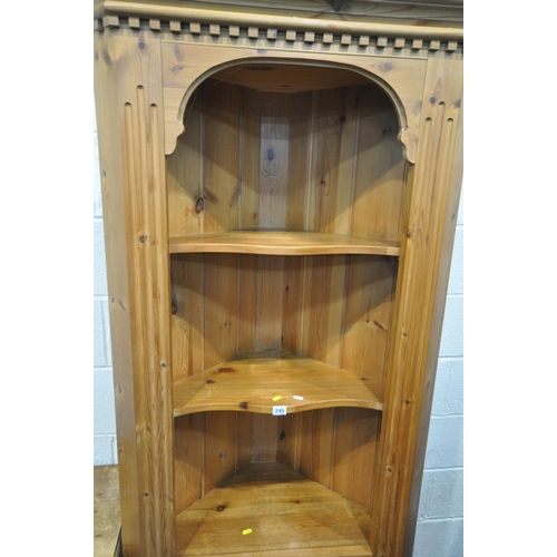 245 - A PINE CORNER CUPBOARD, with two shelves, over a single cupboard door, width 83cm x depth 44cm x hei... 