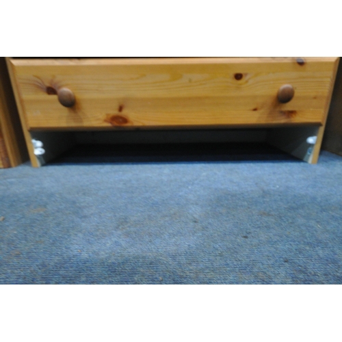 253 - A MODERN FOUR PIECE PINE BEDROOM SUITE, comprising a chest of two short over seven drawers, width 78... 