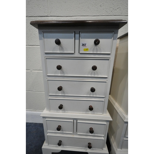 267 - A PAIR OF PARTIALLY PAINTED PINE CHEST OF EIGHT ASSORTED DRAWERS, with a stained hardwood top, width... 