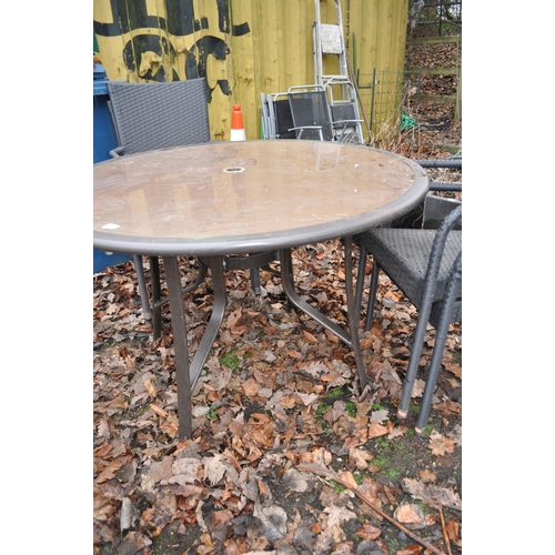 13 - A GLASS TOPED METAL FRAMED GARDEN TABLE diameter 110cm and four rattan style chairs (5)