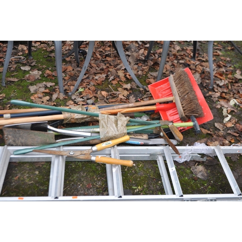 5 - A COLLECTION OF GARDEN TOOLS AND A STEP LADDER, including snow shovels, clippers, spades, etc.