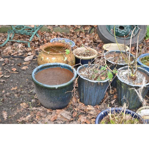 8 - A COLLECTION OF BLUE GLAZED PLANTERS, including a set of three tapered pots, 32cm in diameter, a ter... 