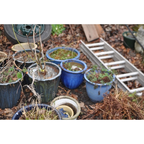 8 - A COLLECTION OF BLUE GLAZED PLANTERS, including a set of three tapered pots, 32cm in diameter, a ter... 