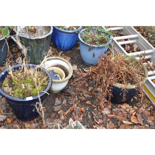 8 - A COLLECTION OF BLUE GLAZED PLANTERS, including a set of three tapered pots, 32cm in diameter, a ter... 