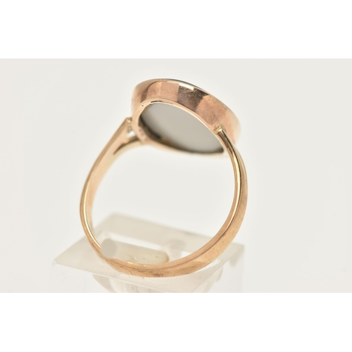 402 - A 9CT GOLD OPAL TRIPLET RING, of an oval form, collet set to the bifurcated shoulders and polished b... 