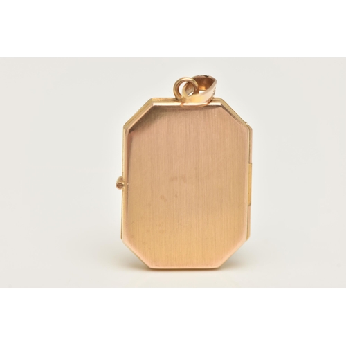 403 - A 9CT GOLD LOCKET PENDANT, of a rectangular form decorated with a floral pattern, opens to reveal tw... 