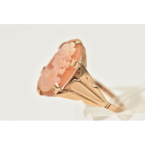 420 - A 9CT GOLD CAMEO RING, an oval shell cameo depicting a female profile, prong set in yellow gold, tap... 