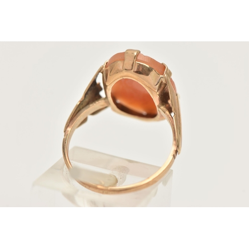 420 - A 9CT GOLD CAMEO RING, an oval shell cameo depicting a female profile, prong set in yellow gold, tap... 