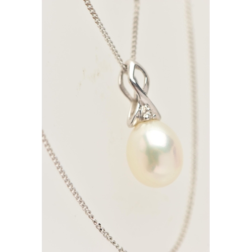 424 - A 9CT GOLD AND PEARL NECKLACE, an oval cultured pearl set in a white gold cross over mount set with ... 