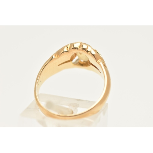 444 - A YELLOW METAL CITRINE SET RING, set with an oval cut Citrine, claw set to the scrolling openwork sh... 