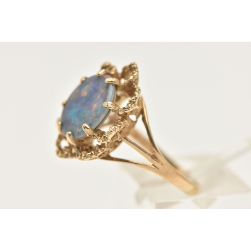 451 - A 9CT GOLD OPAL TRIPLET RING, set with an oval cut opal triplet, in an eight claw setting to the tex... 