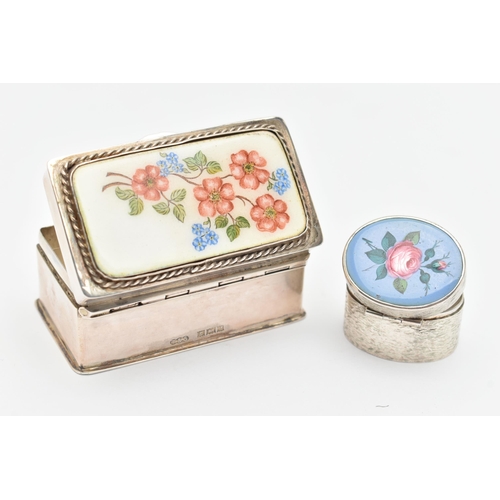 469 - TWO SILVER AND ENAMEL PILL BOXES, the first of a rectangular form, decorated with a floral pattern t... 