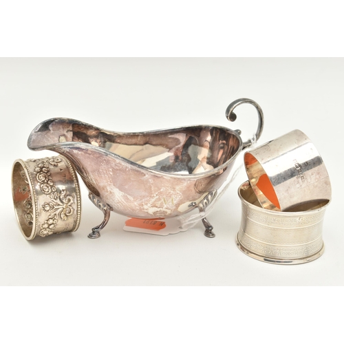 473 - A SILVER SAUCE BOAT, TWO SILVER NAPKIN RINGS AND ONE WHITE METAL NAPKIN RING, the polished form sauc... 