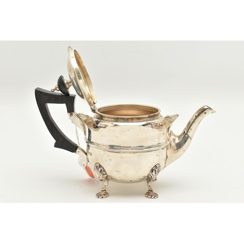 480 - AN EARLY 20TH CENTURY SILVER TEAPOT, polished teapot with wavy rim, fitted with an ebonised handle a... 