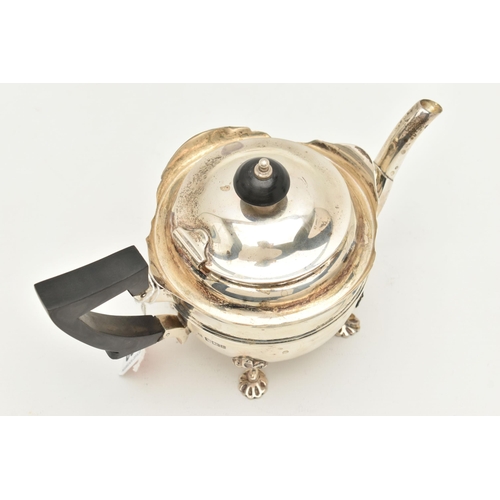 480 - AN EARLY 20TH CENTURY SILVER TEAPOT, polished teapot with wavy rim, fitted with an ebonised handle a... 