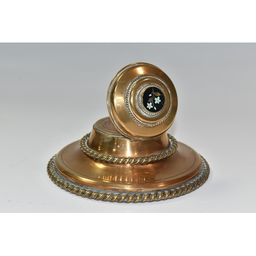 773 - A NINETEENTH CENTURY BRASS INKWELL, of circular form with rope style edging, and a Pietra dura flora... 