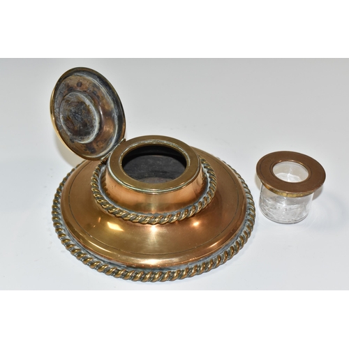 773 - A NINETEENTH CENTURY BRASS INKWELL, of circular form with rope style edging, and a Pietra dura flora... 