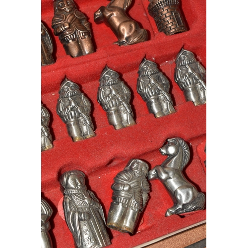 780 - A BOX AND LOOSE CHESS PIECES AND COLLECTORS DOLLS, comprising an Ajedrez metal chess set in a fitted... 