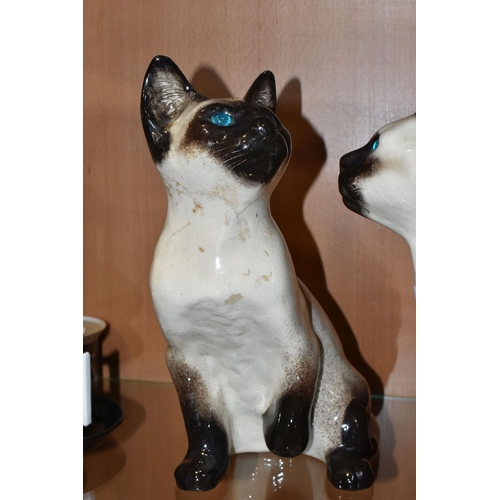 783 - THREE WINSTANLEY POTTERY SIAMESE CATS, comprising a seated cat T34, height 23cm (chipped left ear, a... 