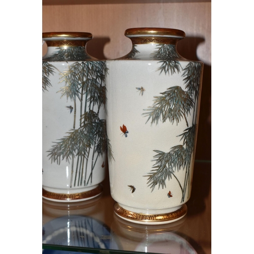 790 - A PAIR OF JAPANESE VASES, decorated with bamboo and butterflies highlighted in gilt, iron red and gi... 