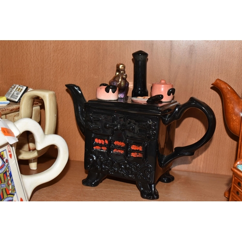 810 - EIGHT NOVELTY TEAPOTS, comprising a South-West Ceramics Ltd Alice in Wonderland themed teapot (two s... 