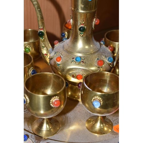 818 - THREE DECORATIVE ARABIC COFFEE SETS AND AN ORNAMENTAL DALLAH comprising an Anglo-Indian brass dallah... 