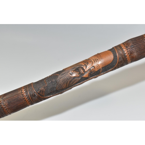 831 - A JAPANESE MEIJI PERIOD SAMURAI CARVED BAMBOO WALKING STICK carved in relief with five carved faces ... 