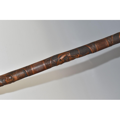 831 - A JAPANESE MEIJI PERIOD SAMURAI CARVED BAMBOO WALKING STICK carved in relief with five carved faces ... 