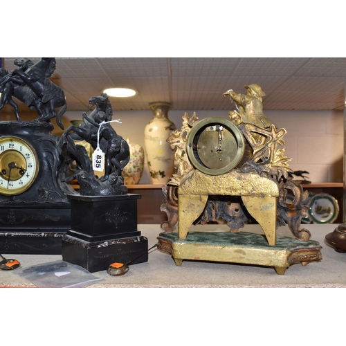 835 - A GILDED METAL CLOCK AND A BLACK SLATE AND MARBLE CLOCK GARNITURE comprising a gilded metal mantel c... 