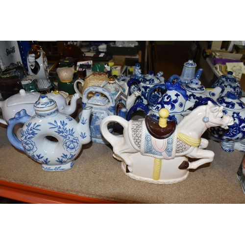 845 - A COLLECTION OF TWENTY-THREE NOVELTY TEAPOTS to include six blue and white animal-shaped teapots com... 