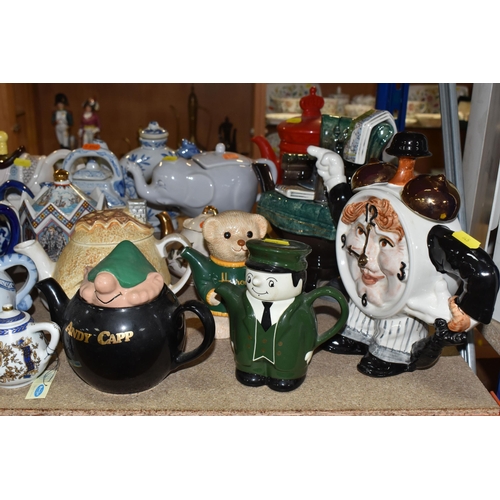 845 - A COLLECTION OF TWENTY-THREE NOVELTY TEAPOTS to include six blue and white animal-shaped teapots com... 